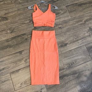 A Bebe 2 piece pink crop top and skirt